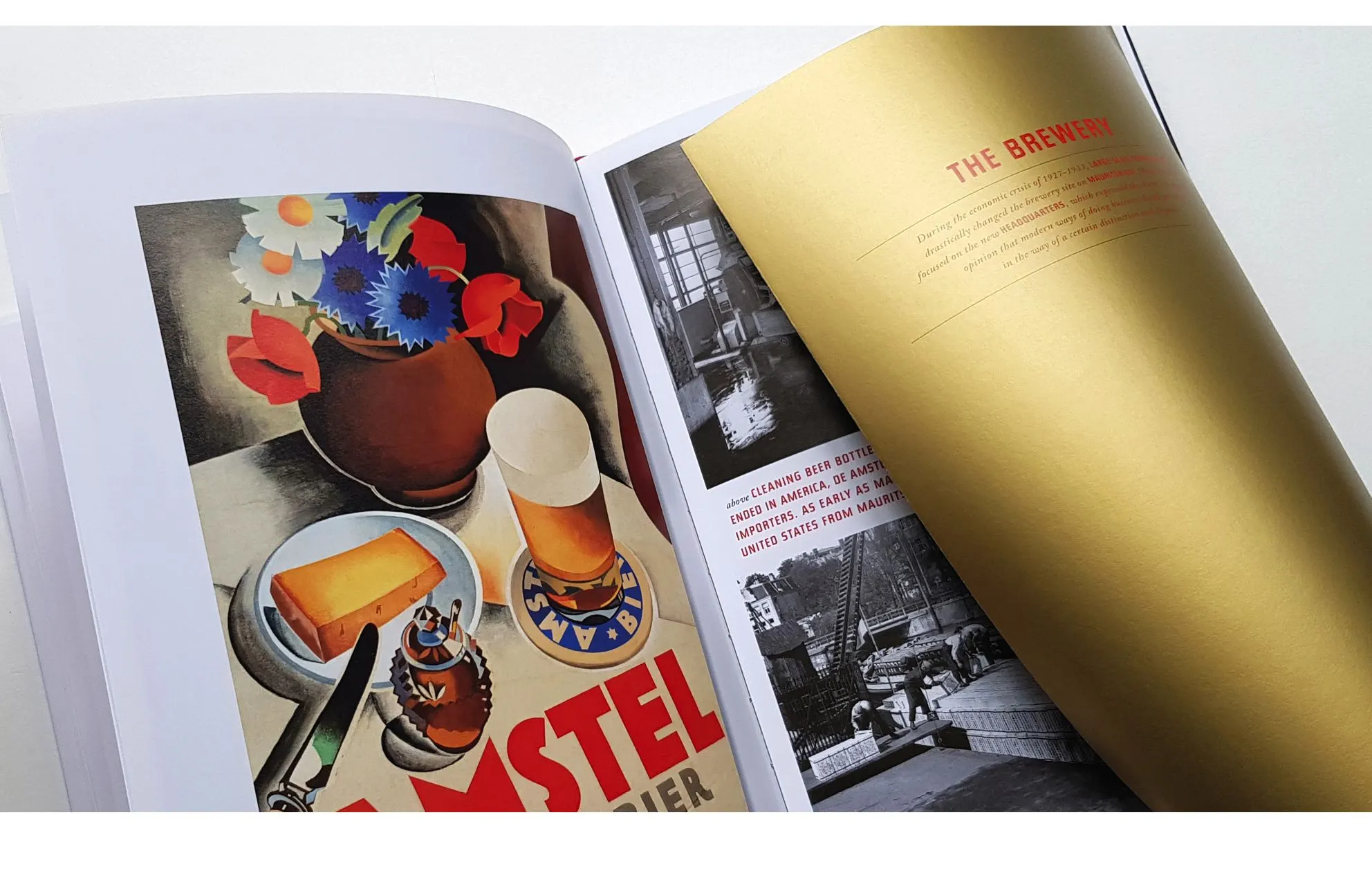 Open book with a vintage Amstel poster of flowers, beer glass and cheese beside a gold page titled The Brewery