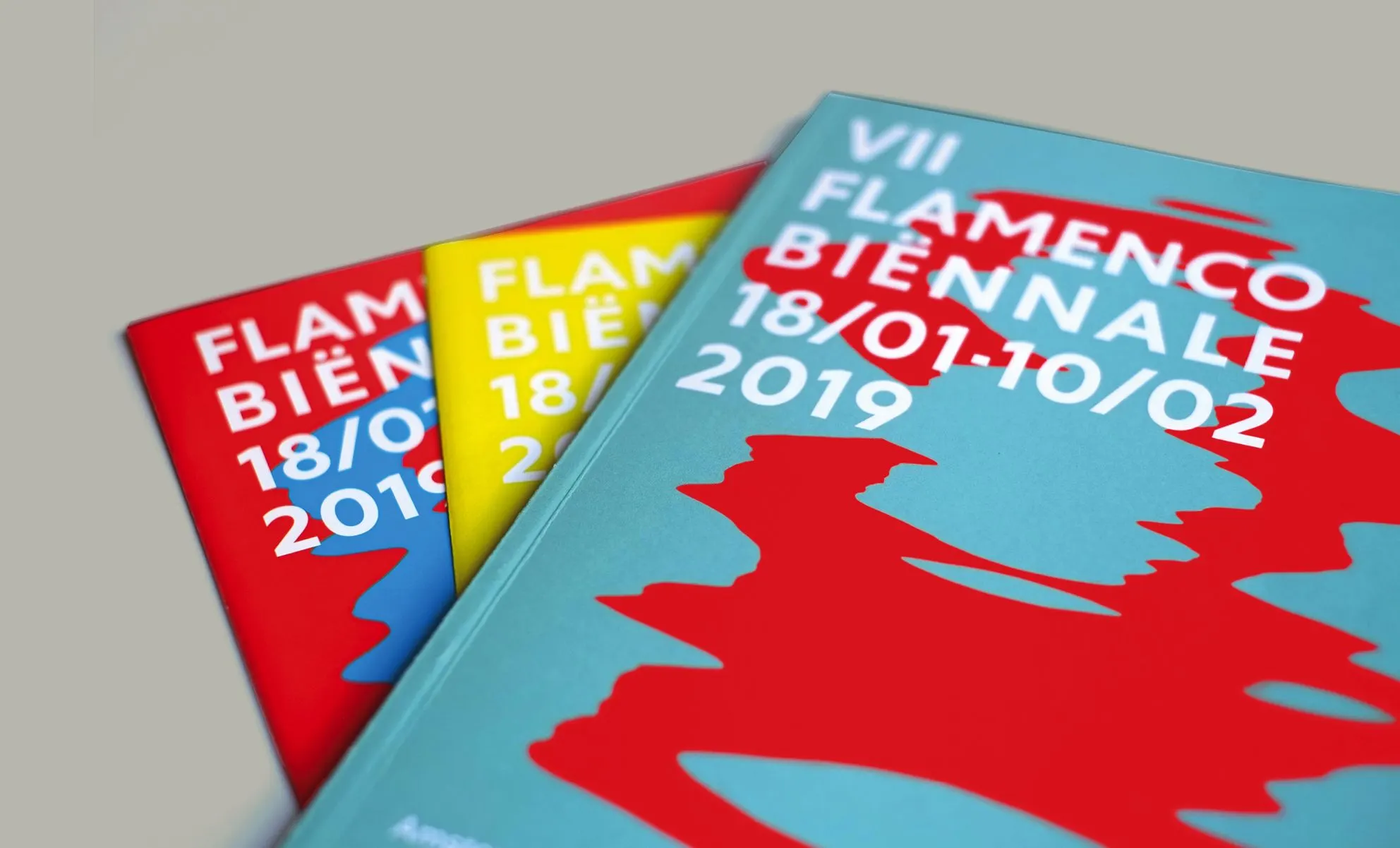 Red, yellow and turquoise programme brochures reading VII Flamenco Biënnale 18/01-10/02 2019