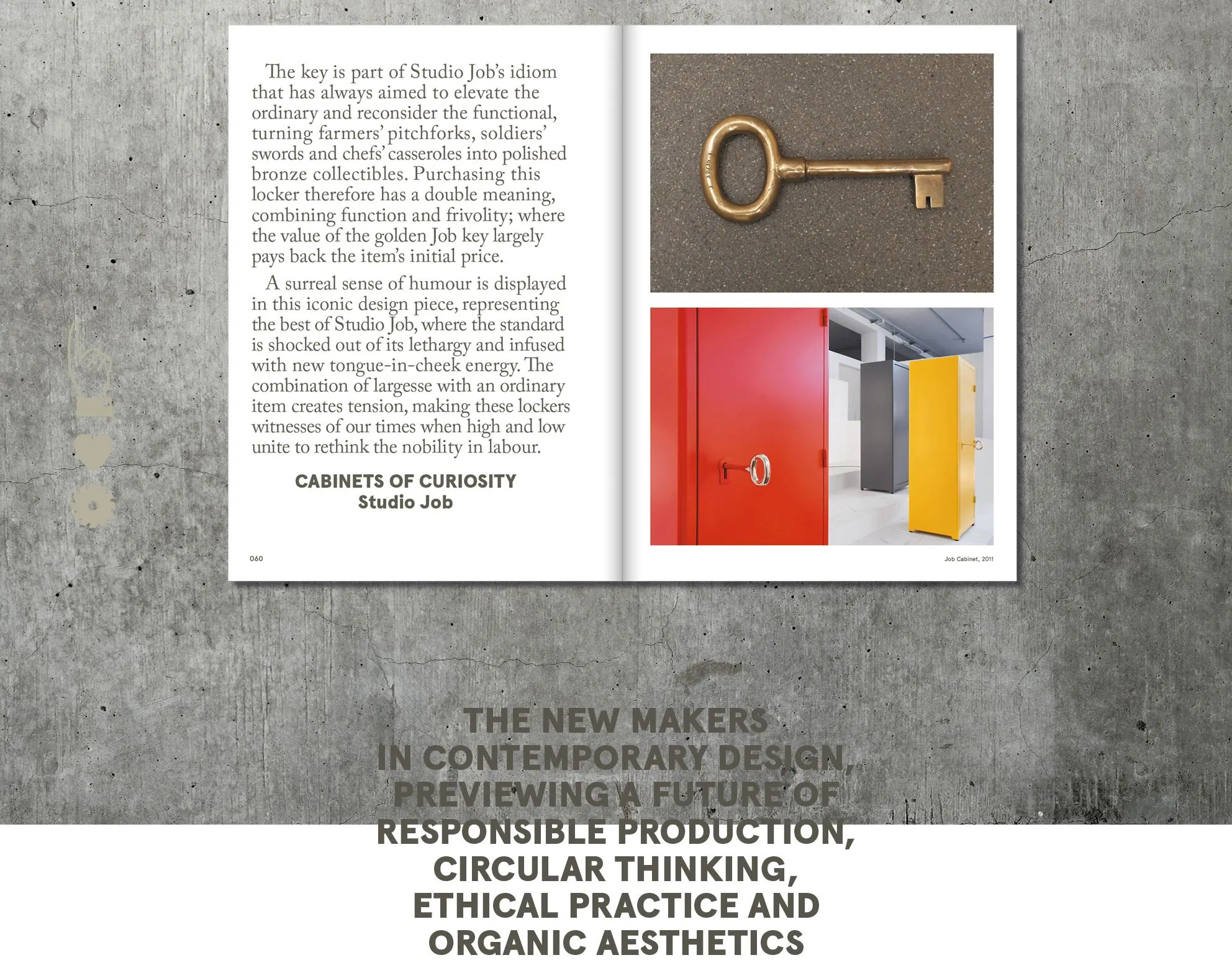 Book spread on Studio Job's Cabinets of Curiosity with a golden key and red-and-yellow lockers, on a concrete background