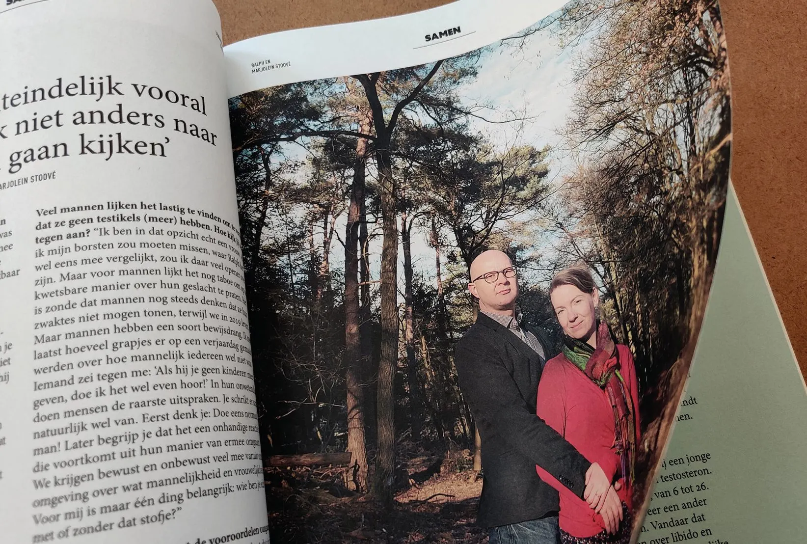 HERMAN magazine open at a spread with a photo of a man and a woman standing in a forest