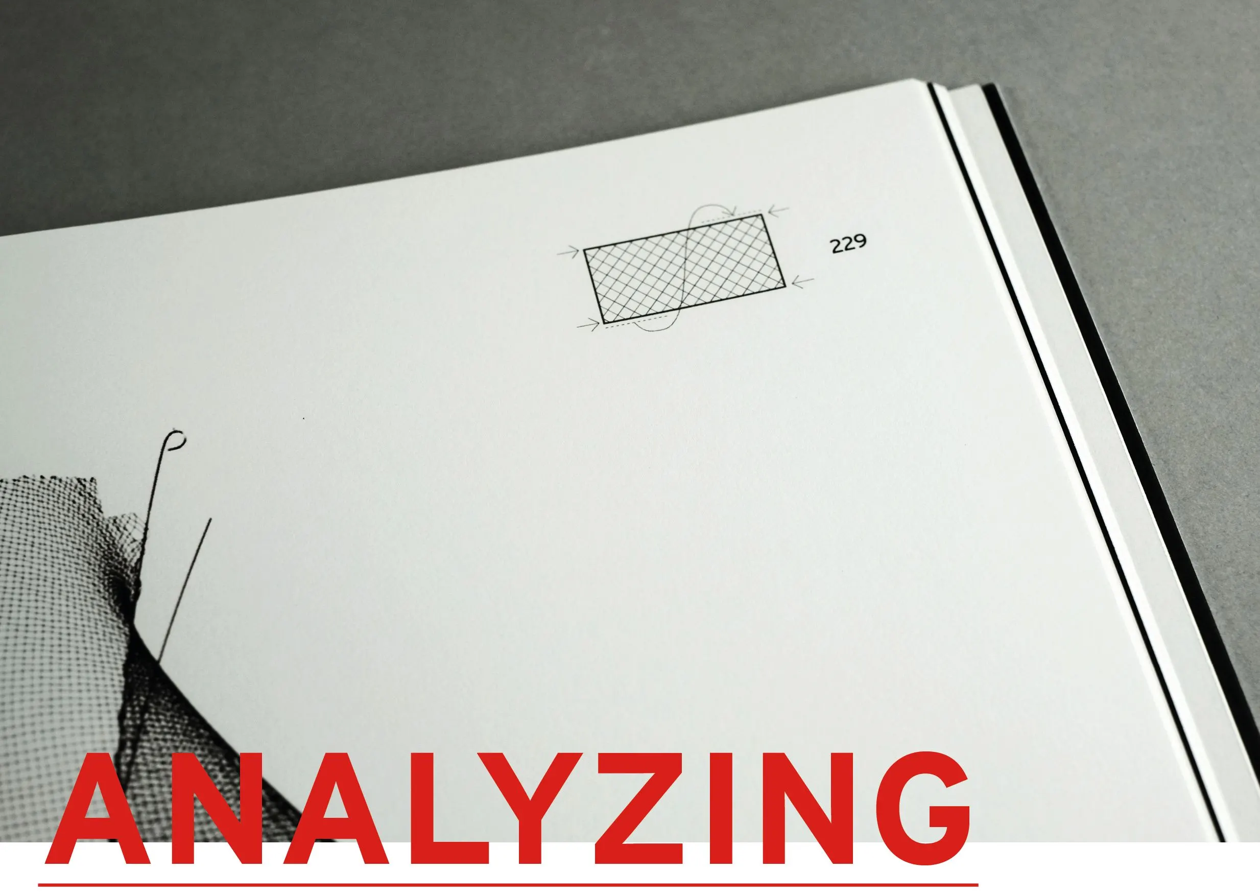 Book page with a technical drawing of a mesh structure and the word Analyzing in red capitals