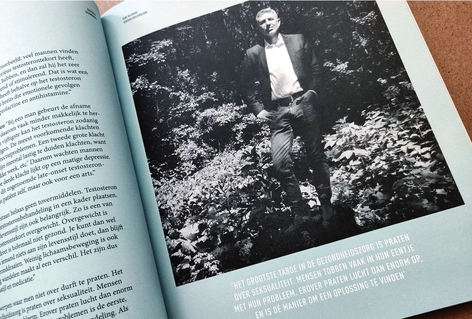 Close-up of a HERMAN spread with a black and white photo of a standing man among foliage and a text column