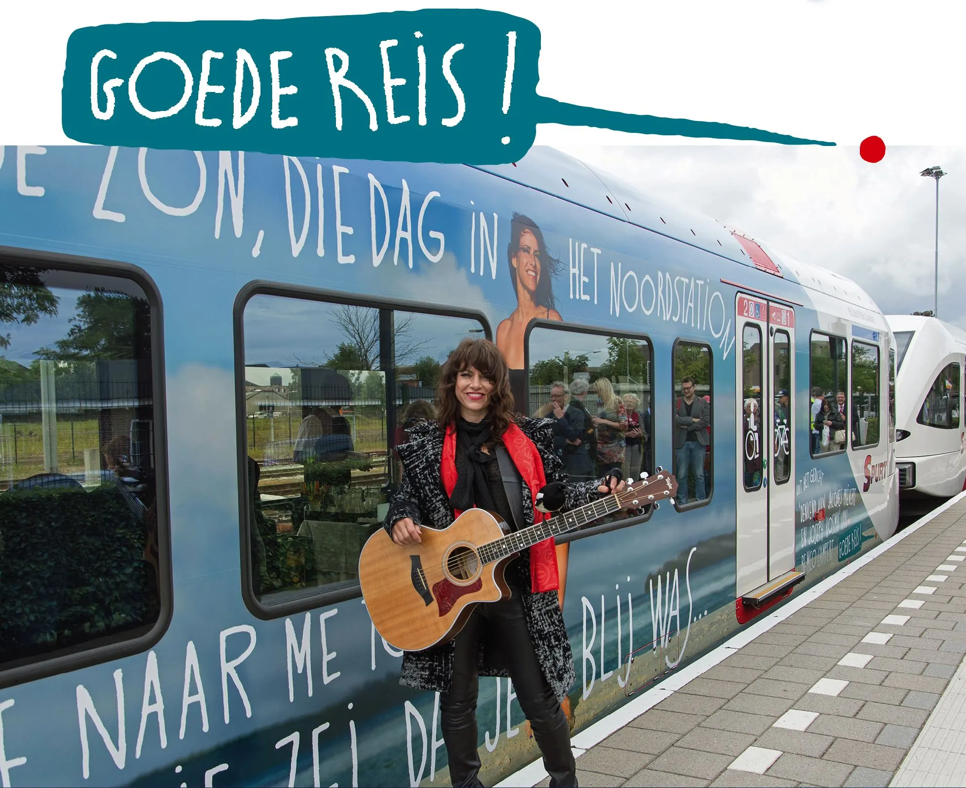 Woman with an acoustic guitar beside the decorated Arriva train, with a speech bubble reading Goede reis!