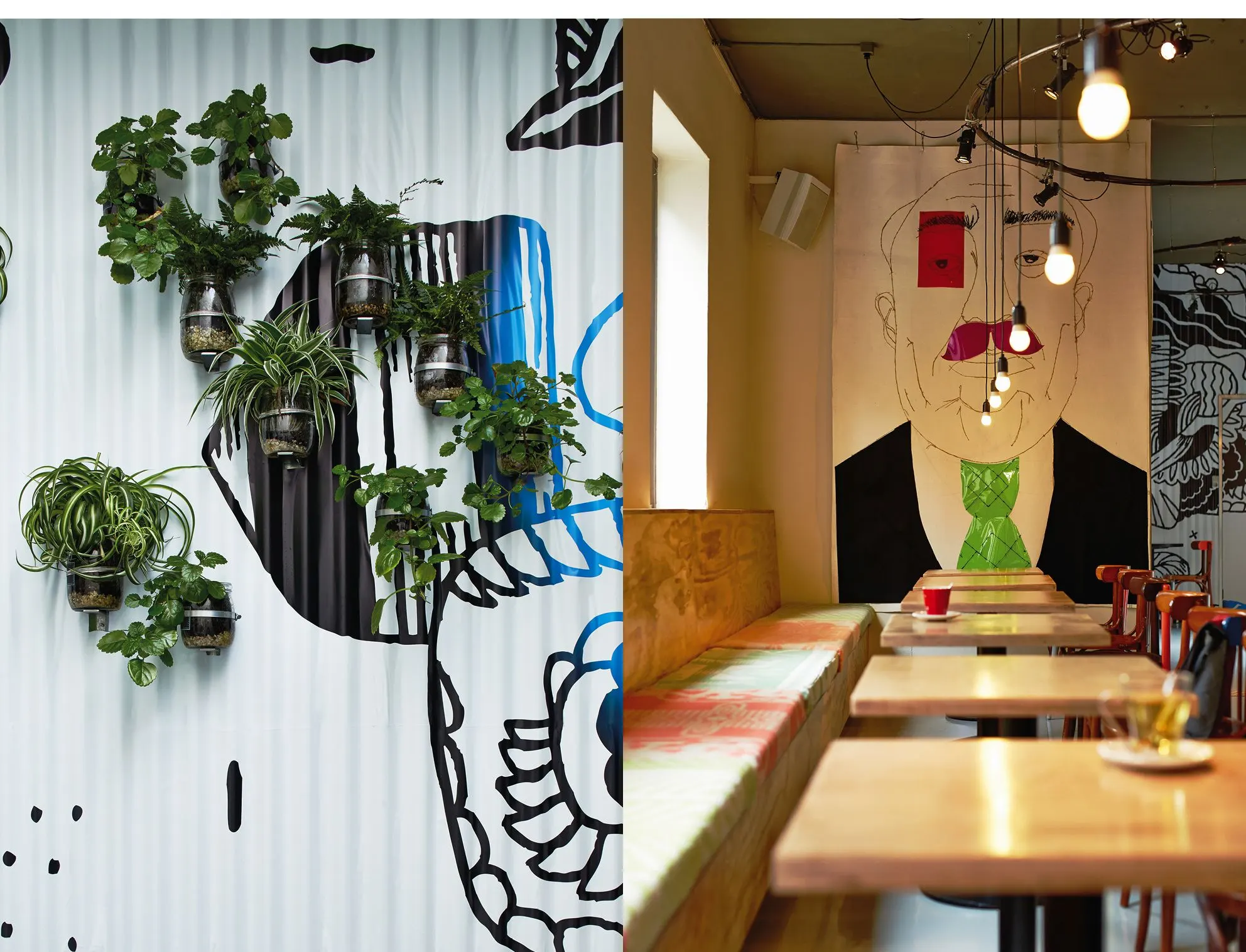 Theatre café interior with wall planters and black-and-white mural, and a long wooden bench with tables and lamps